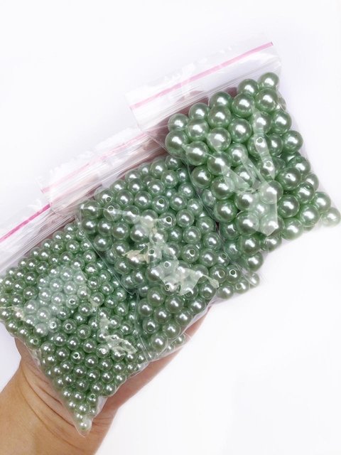 pérola verde claro com furo passante - 50 gramas