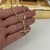 Imagem do CORRENTE ELO LONGO 3MM + PINGENTE CRUZ TRANÇADA 2,2x3,4CM