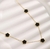 CORDÃO TREVO PRETO FLOR - BANHADO A OURO 18K - comprar online