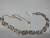Cinto Metal Curvas Cores Prata e Dourado - comprar online