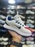 Nike Bailleli - Branco/Azul/Vermelho na internet