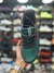 Imagem do Fresh Foam" and "More Trail - Verde/Marrom Vinho