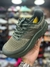 Fresh Foam" and "More Trail - Verde Lodo - Eltinho Outlet