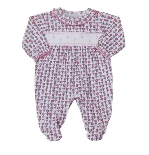 Macacão Anjos Baby com estampa de flores em tons de rosa e branco, ideal para bebês.