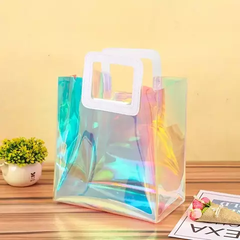 Bolsa de pvc holográfica con manija de cuerina. Precio por unidad