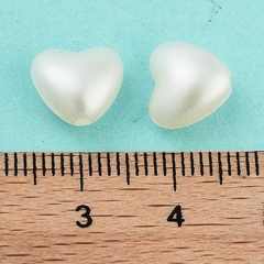 CUENTAS CORAZON BLANCO PERLADO X 25 GR 100 U APROX en internet