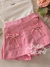 Imagem do Conjunto infantil regata canelada branca e short saia rosa com laços Animê P6283