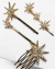 Conjunto de grampos para cabelo dourados com detalhes em estrela e strass.