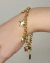 pulseira com pingentes estrela dourado