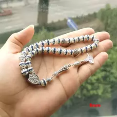 Masbaha.Tasbih. Metal plateado con incrustaciones de cristal azul. Rezo. Islam. ✈️ Envío internacional. Entrega estimada entre 15 y 30 días hábi