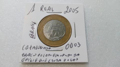 Moedas de 1 Real de 2005 Traço do Lado Esquerdo da Efigie e Que Cruza o Olho Catalogada OD 03 - loja online