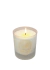 Vela perfumada de patchouli e baunilha acesa em um recipiente de vidro fosco.