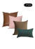 Kit de almofadas nas cores verde floresta, rosé e marrom, composto por 4 peças com diferentes texturas.