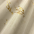Efeito do Papel de Parede Galhos Bege e Dourado Brilho Vinílico Lavável - Coleção Enchantment - 10 metros | 120308 - Ciça Braga