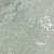 Detalhe do Papel de Parede Cimento Queimado Cinza Mescla Bege com Brilho Metálico - Coleção White Swan Kantai 101603 | 10 metros | Cola Grátis - Ciça Braga