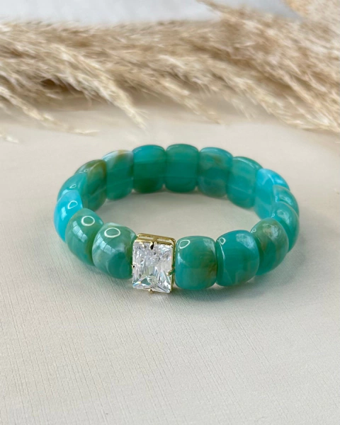 PULSEIRA PEÇAS RESINADAS ENTREMEIO PEDRA CRISTAL DOURADO - comprar online