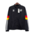 Jaqueta Corta-Vento Alemanha 24/25 - Masculina Adidas - Preta com detalhes vermelhos e amarelos