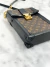 Bolsa Louis Vuitton Pochette Trunk Verticale Monograma