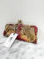 Clutch Louboutin Miss Loubi Python na internet