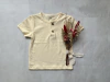 REMERA CON BOTONES AMARILLA