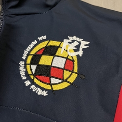 JAQUETA CORTA VENTO ESPANHA - PRETO 24/25 na internet