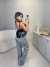 Blusa com babados frontais no crepe premium e amarração - preto - loja online