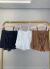 Conjunto de saia e blusa com babados e amarração frontal - off white