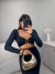 Conjunto de cropped com detalhe geométrico e saia franzida - Preto on internet