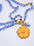 Colar Flor Laranja Pastel na internet