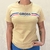 Camiseta feminina da marca Gross Hunter na cor palha, com estampa frontal em azul e listras vermelha e azul.