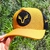 Boné Gross Hunter amarelo com detalhe em preto e logo de chifres