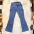 Calça jeans infantil feminina Country&Cia modelo 4503 com bordados de chapéu, bota e cacto, estilo country, exibida sobre tapete claro.