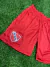 Shorts rojos con el escudo de Independiente, confeccionados en material ligero y cómodo.