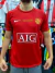 Camiseta retro de Manchester United de Cristiano Ronaldo, modelo de 2008, color rojo con el logo de AIG y emblema del club.