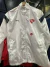Rompeviento blanco de la marca Puma, con el escudo del Club Atlético Independiente en el pecho.