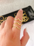 Anel vê duplo cravejado com zircônias, banhado a ouro 18K.