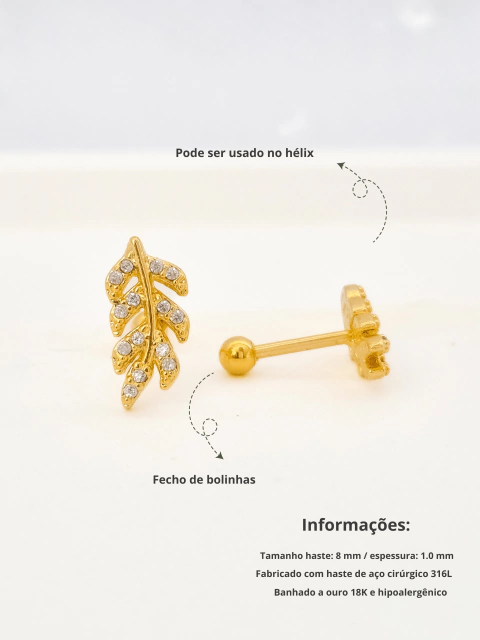 Piercing de folhas cravejado com zircônias, banhado a ouro 18K. - comprar online