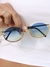 Óculos Rebeca lente azul, haste dourado, armação metal oval. Proteção UV400, resistente a riscos. Revenda R$59,90-R$199,90. Compre no atacado Clush!
