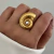 Anillo Caracola Regulable | Acero Dorado