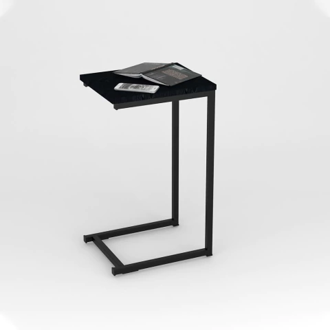 mesa de arrime con libro y celular