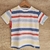 Remera rayada para niños con colores azul, rojo, amarillo y blanco