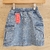 Falda de jeans para niña, color azul, con cintura elástica y dos bolsillos laterales.