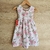 Vestido Anette para niñas, de fondo blanco con estampado de rosas en tonos rosa y verde