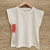 Remera de algodon  sin mangas con detalle de broderie .