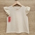 Remera sin manga, de algodon con volado de broderie en hombro