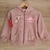 Campera rosa para bebé con capucha y cierre, con diseño de flor y texto "Baby Power".