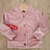 Saco de plush rosa con capucha
