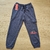 Pantalones de niño en algodón con bolsillo lateral.