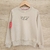Buzo de algodon color beige con estampa