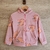 Campera rosa con estampado de capibaras comiendo helado, 